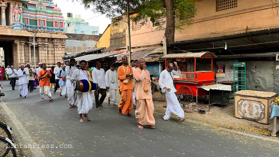 Devotees walking into temple